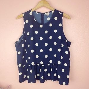 Sleeveless polka dot top with ruffled peplum hem